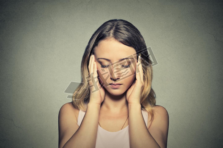 stressed sad young woman with eyes closed 