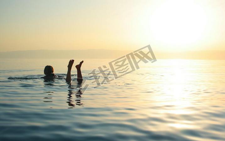 Woman swimming in salty water