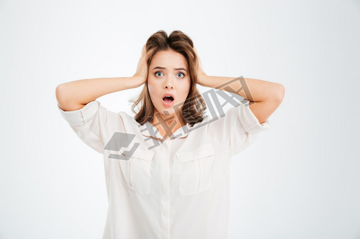 Woman covering ears and shouting