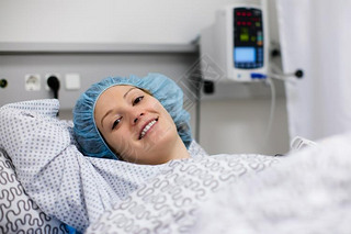 Young woman in hospital recovery room after surgery