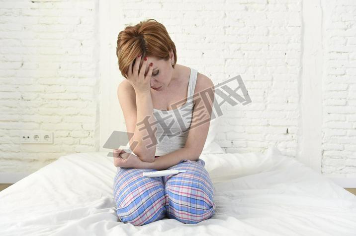 young sad woman crying frustrated after checking negative or positive pregnancy test 