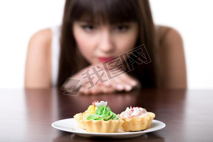 Dieting woman cring for cake