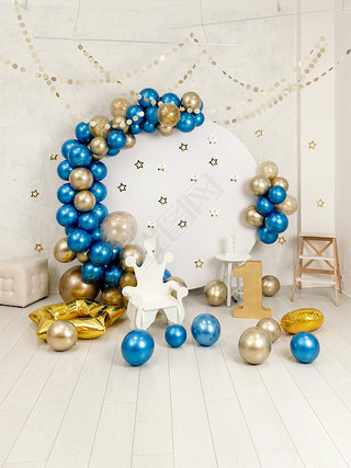 Birthday decorations - gifts, toys, balloons, garland and number for little baby party event on a wh