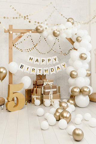 Birthday decorations - gifts, toys, balloons, garland and number for little baby party event on a wh