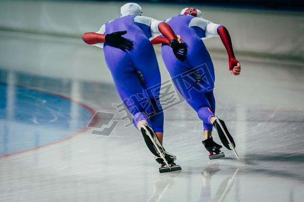 closeup two men skaters synchronous running