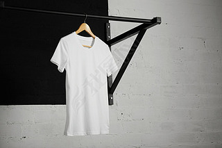 white t-shirt on cross fit pull bar in gym