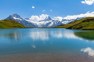 Stunning view of Bachalpsee and the snow coverd peaks with glacier of swiss alps, on Bernese Oberlan