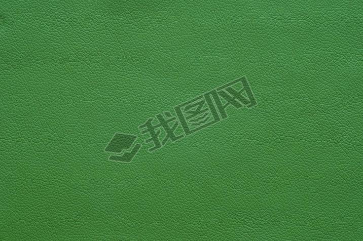 Large texture of bright green artificial leather, background.