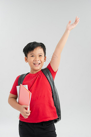 Back to school. Happy exciting child boy ready to study with backpack isolated on white. Kid win and