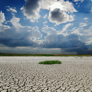 drought earth under rainy clouds