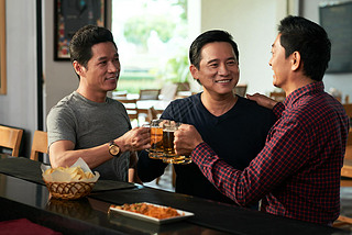 Mature Asian men toasting for his friends