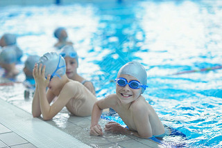 Happy kids at swimming pool