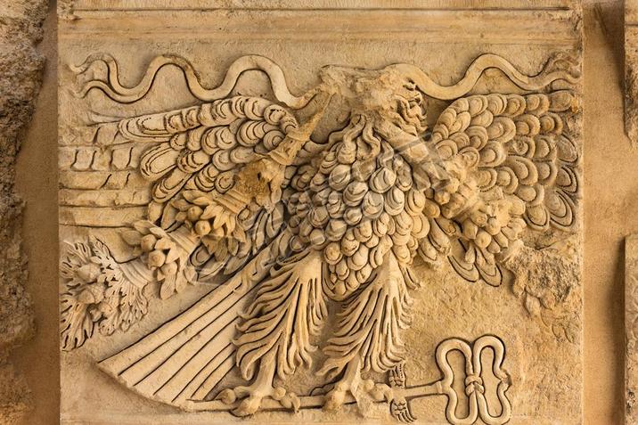 Eagle holding a herald's staff carved at the entrance of Bacchus temple, Heliopolis Roman ruins, Baa