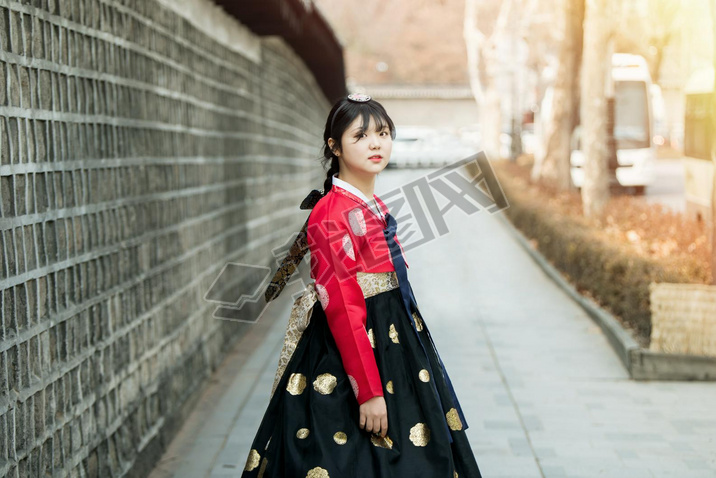 Beautiful Korean girl in Hanbok at Gyeongbokgung, the traditional Korean dress