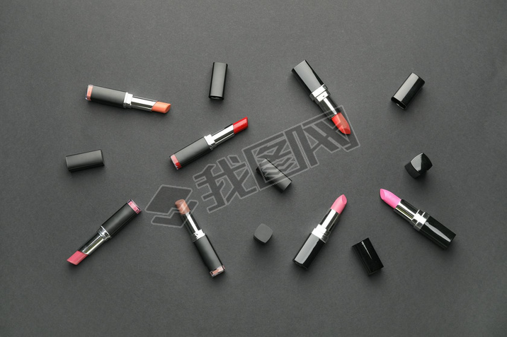 Different lipsticks on dark background