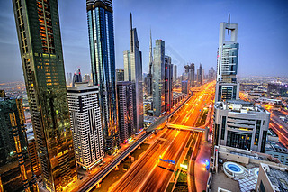Dubai sunset panoramic view of Burj Khalifa with Sheike Zayed road. Dubai is super modern city of UA