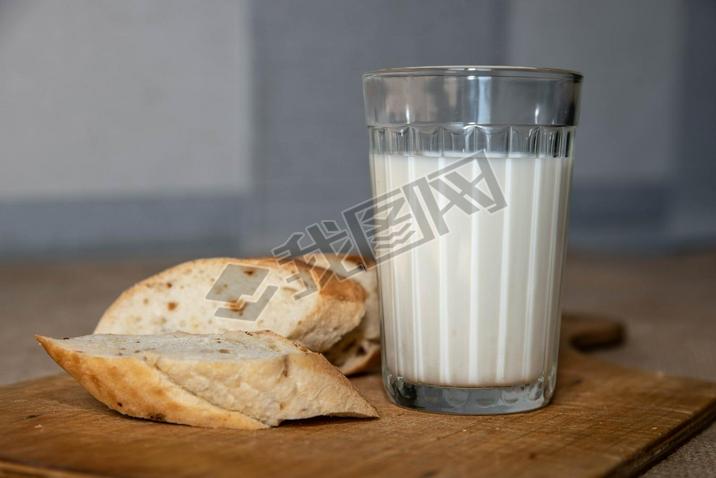 glass Cup with milk and sliced bread