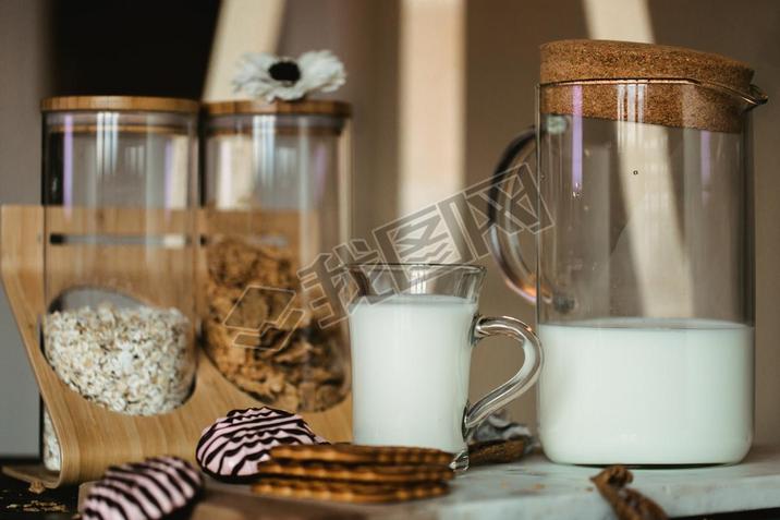Flakes and cup of milk for breakfast. Concept of healthy food. Warm toning image. Rustic styling
