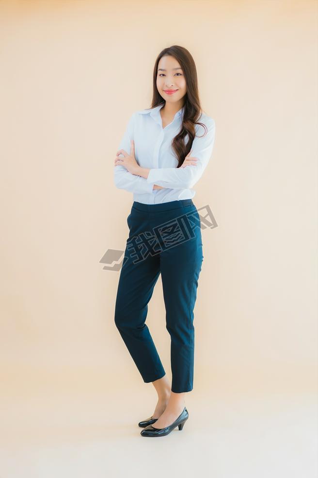 Portrait beautiful young asian business woman in action on isolated color background