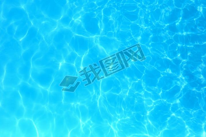 Blue color water in swimming pool rippled water detail backgroun