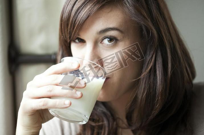 Young Woman Drinking Milk