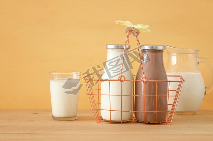 image of milk and chocolate over wooden table. Symbols of jewish holiday - Shuot.