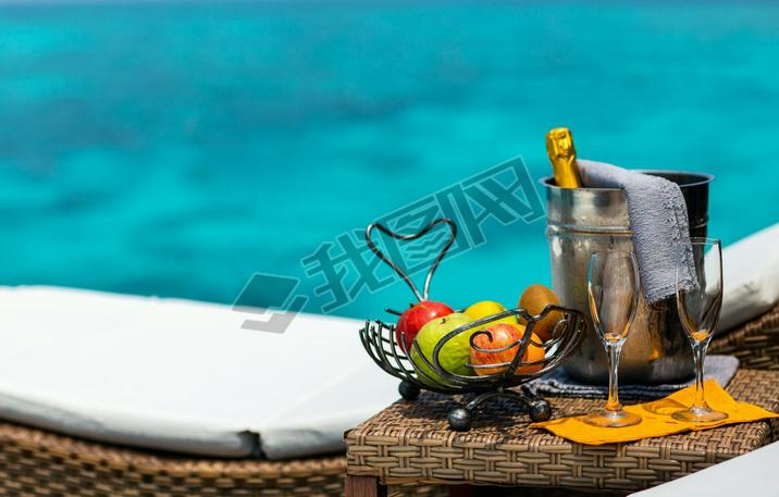 Two glasses with champagne  and fruits