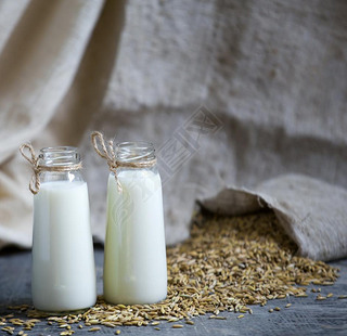 Oatmeal in bottles and oats in a bag