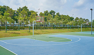 Outdoor open basketball court under sunny sky . Healthy lifestyle sport background .