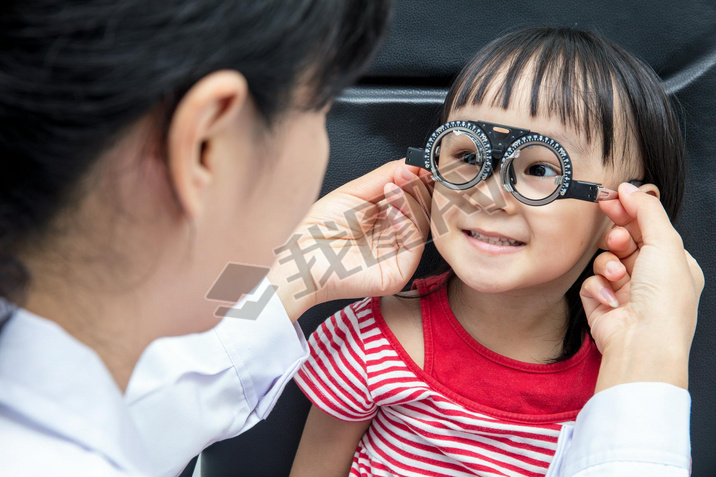 Asian Little Chinese Girl Doing Eyes Examination by ophthalmolog
