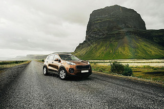SUV car. Trel concept with big 4x4 sport and modern car in mountains. Iceland. Beautiful landscape