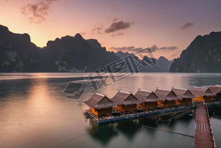 Beautiful sunset over the raft houses on Cheow Lan lake, Thailand. 