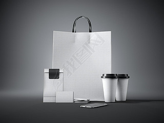 Set of white craft shopping bag, two coffee cups, business cards and generic design artphone. Dark