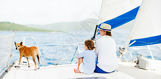 Family sailing on a luxury yacht