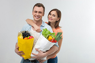 Cute young family is shopping together with joy