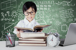 Kid reading books with clock on the table