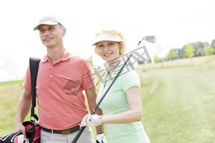 female friends standing at golf course