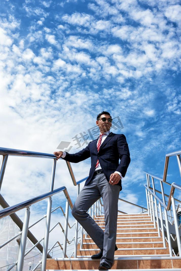 Young successful entrepreneur oking a cigarette