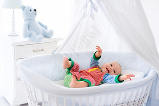 Cute baby in white nursery