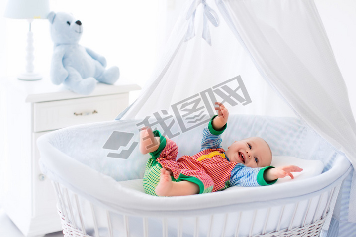 Cute baby in white nursery