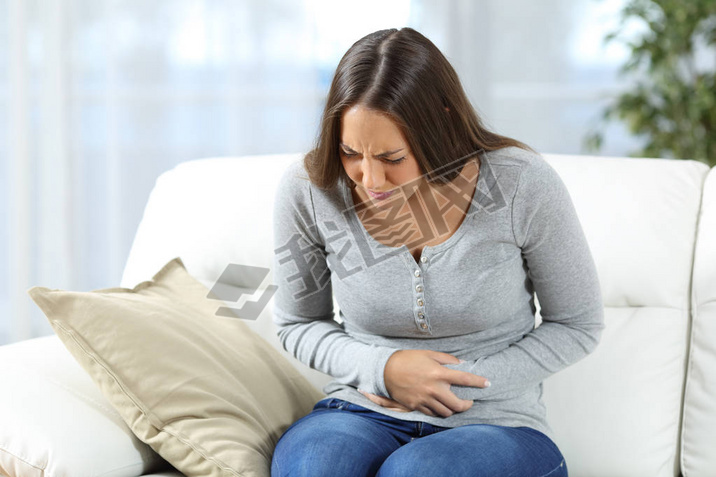 Woman suffering stomach ache