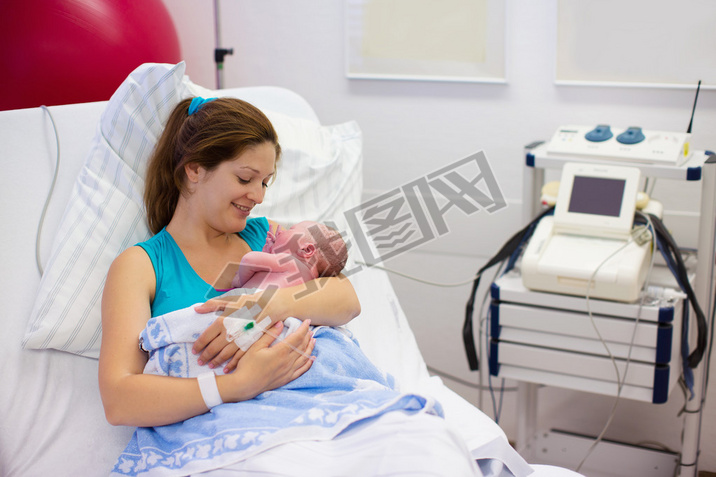 Young mother giving birth to a baby