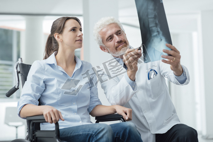 Doctor examining a patient x-ray
