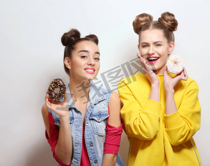 women with tasty donuts