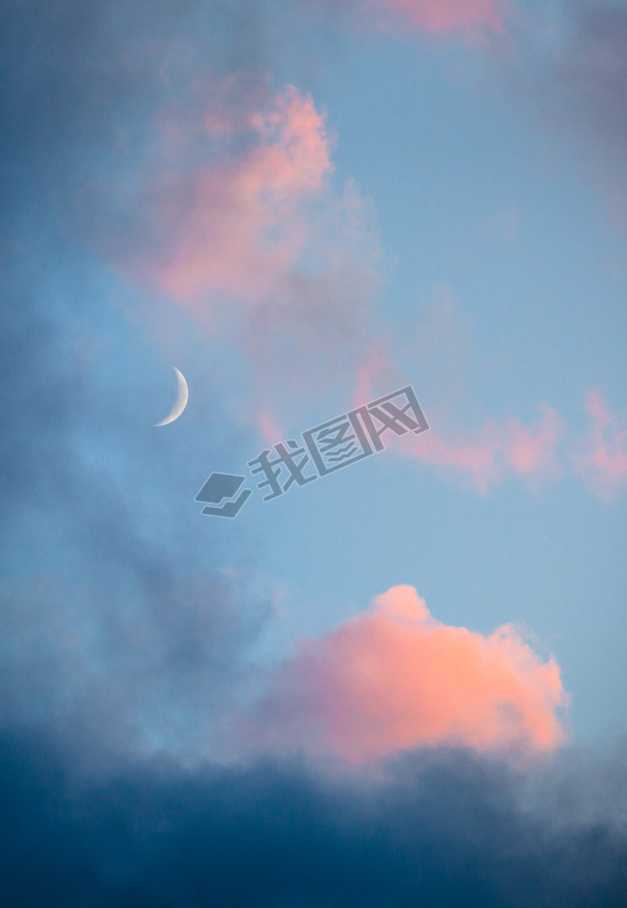 Pink clouds and moon heen closeup