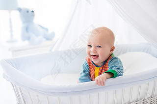 Cute baby in white nursery