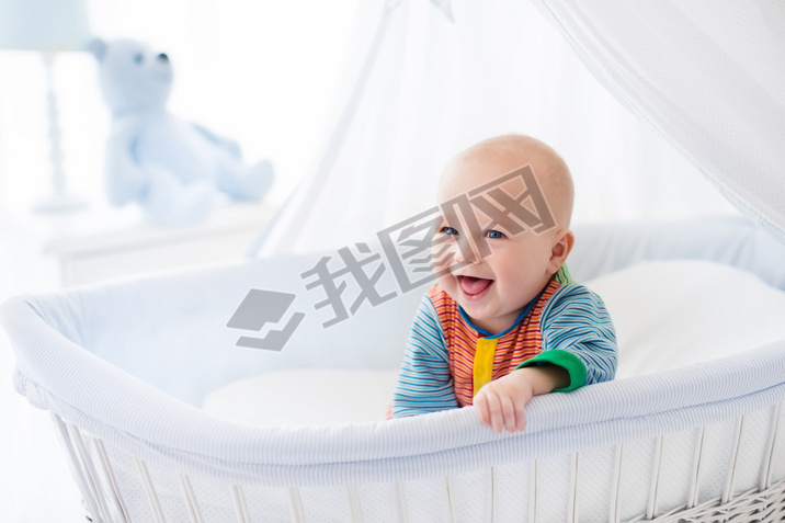 Cute baby in white nursery