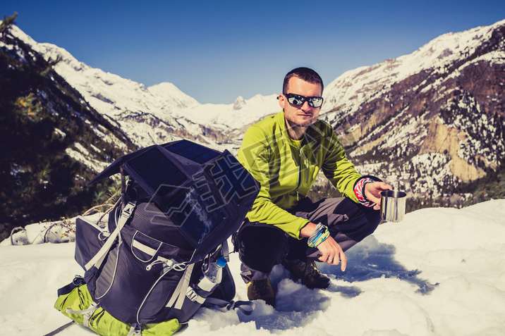 Man camping and hiking in Himalaya Mountain pass in Nepal