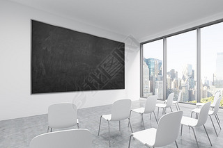 A classroom or presentation room in a modern university or fancy office. White chairs, a black chalk