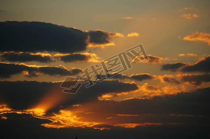 Beautiful shot of the cloudy orange sky during sunset